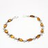 Ezüst karkötő borostyánnal Tigris szem